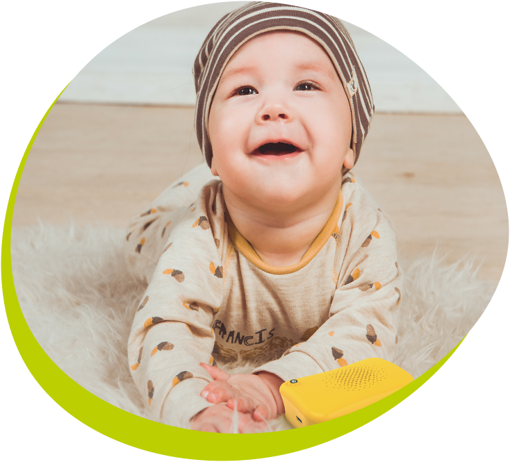 A happy child holding Talkido Mio